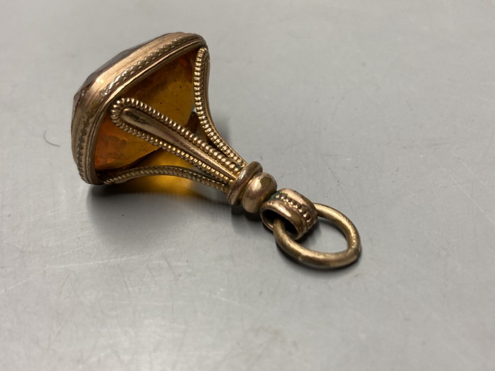 Two gold plated overlaid and gem set fob seals, largest 35mm, a 9ct front and back locket and a scroll brooch.